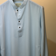 Soft pastel sky blue with subtle tonal self-stripes