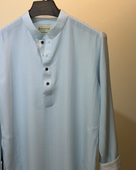 Soft pastel sky blue with subtle tonal self-stripes