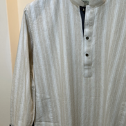 Cream with subtle white pinstripes