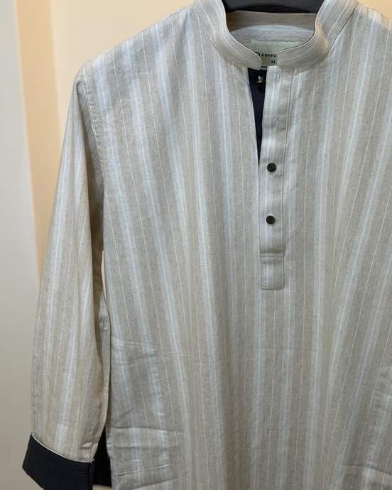 Cream with subtle white pinstripes