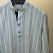 Cream with subtle white pinstripes