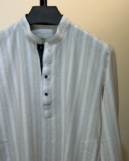 Cream with subtle white pinstripes