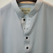 Soft pastel sky blue with subtle tonal self-stripes