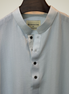 Soft pastel sky blue with subtle tonal self-stripes