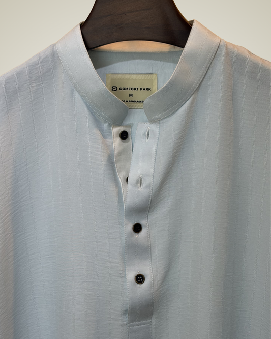 Soft pastel sky blue with subtle tonal self-stripes
