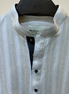 Cream with subtle white pinstripes