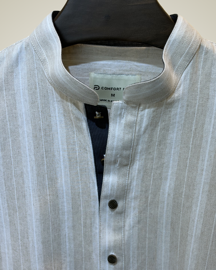 Cream with subtle white pinstripes